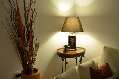 a lamp sitting on a table next to a couch at Pedion Areos Park 5 Center 5 in Athens