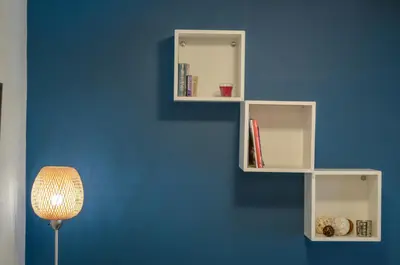 a wall with white shelves on a blue wall at Casa D'Irene Apartments in Athens in Athens