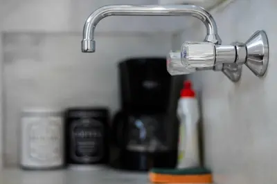 a close up of a bathroom sink with aaucet at Travel Resort in Athens