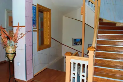 a staircase in a home with a stair case at Diethnes Hotel in Athens