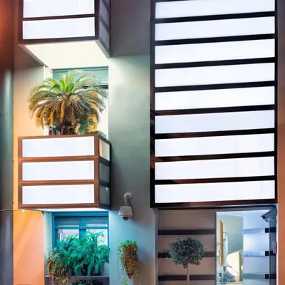 a room with potted plants on a wall at Kallimarmaro Residence in Athens