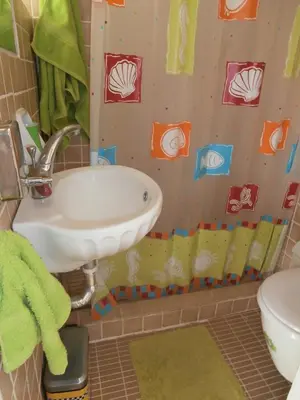 a bathroom with a sink and a toilet at Athens Glyfada Studio in Athens