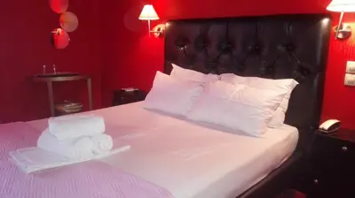 a bedroom with a bed with two towels on it at Feevos in Piraeus