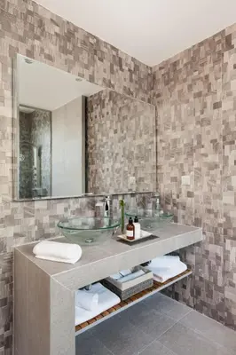 a bathroom with a sink and a mirror at 47 Luxury Suites in Athens