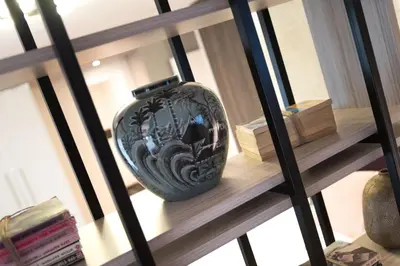 a vase sitting on a shelf in a room at 47 Luxury Suites in Athens