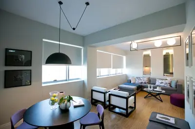 a living room with a table and a couch at 47 Luxury Suites in Athens