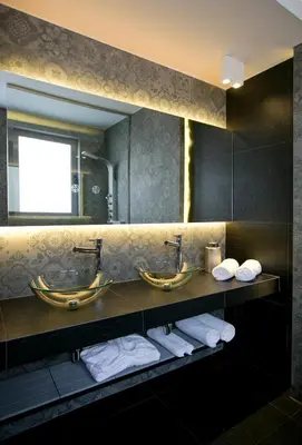 a bathroom with two sinks and two mirrors at 47 Luxury Suites in Athens