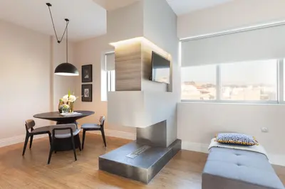 a living room with a table and a couch at 47 Luxury Suites in Athens