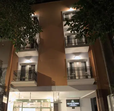 a building with balconies and a sign on it at Allure Athens Urban Suites in Athens