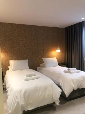 two beds sitting next to each other in a room at SV Acropolis Residence in Athens