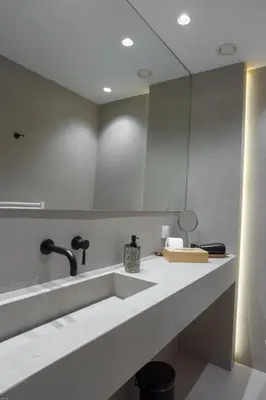 a bathroom with a sink and a mirror at SV Acropolis Residence in Athens