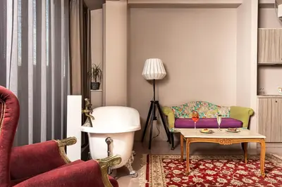 a living room with a couch and a table at iFeel Athens in Athens