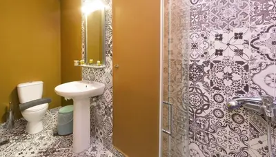 a bathroom with a toilet and a sink and a shower at Monastiraki Place in Athens