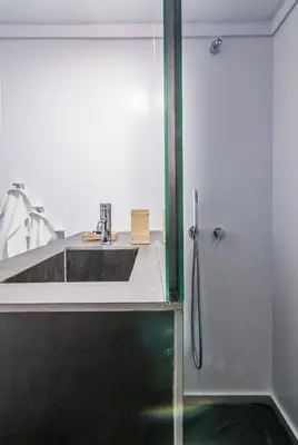 a bathroom with a sink and a shower at ABA Apartment 2 Vourvachi street in Athens