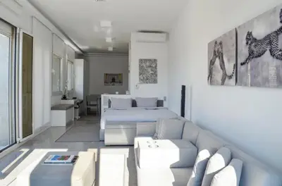 a living room with a bed and a couch at Best Views of Athens in Athens