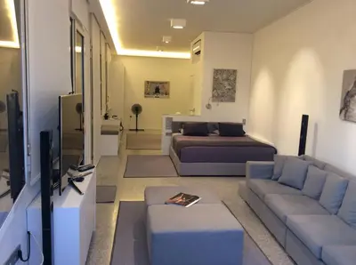 a living room with a couch and a bed at Best Views of Athens in Athens