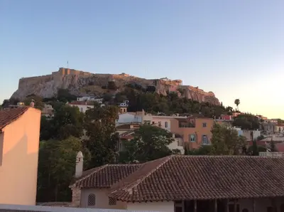 a mountain in the distance with houses and buildings at Best Views of Athens in Athens