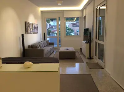 a living room with a couch and a living room with at Best Views of Athens in Athens