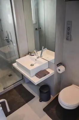 a bathroom with a sink and a shower and a toilet at Best Views of Athens in Athens