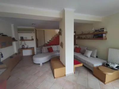 a living room with a couch and a table at Private pool & Panorama View on Athens center Hill in Athens