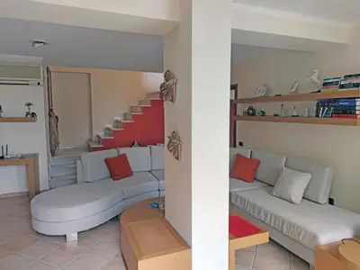 a living room with two couches and a staircase at Private pool & Panorama View on Athens center Hill in Athens