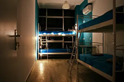 a room with two bunk beds and a hallway at Acropolis View Dream in Athens