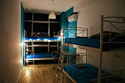 a room with three bunk beds and a window at Acropolis View Dream in Athens