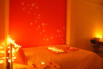 a bedroom with a bed with christmas lights on it at Acropolis View Dream in Athens