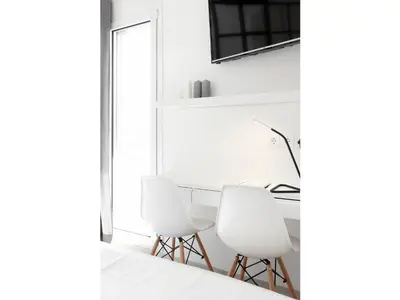 a room with two white chairs and a desk at Athens View Loft - 03 in Athens