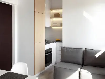 a living room with a couch and a kitchen at Athens View Loft - 03 in Athens