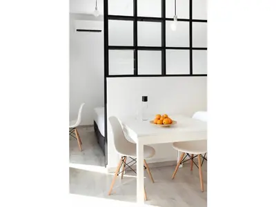 a white dining room with a white table and chairs at Athens View Loft - 03 in Athens