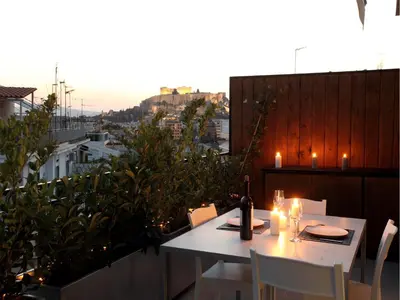 a white table and chairs on a balcony with a view at Athens View Loft - 03 in Athens