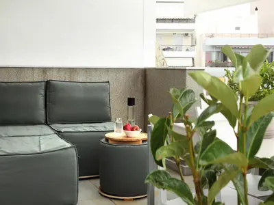 a living room with a couch and a table at Athens View Loft - 04 in Athens