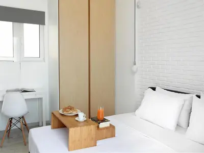 a bedroom with a bed with a wooden table on it at Athens View Loft - 04 in Athens
