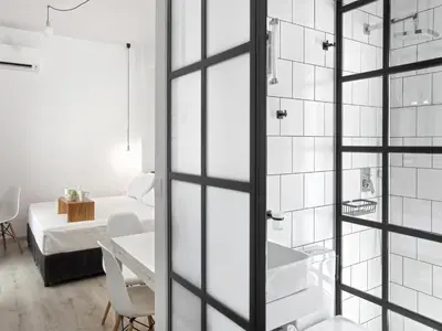 a bathroom with a glass door leading to a bedroom at Athens View Loft - 05 in Athens