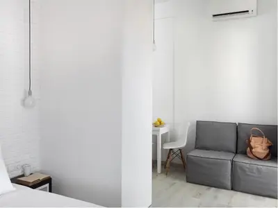 a living room with a couch and a table at Athens View Loft - 06 in Athens
