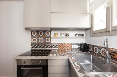 a kitchen with a sink and a counter top at Hidesign Athens Luxury Apartments in Kolonaki in Athens