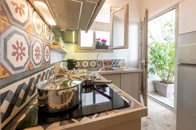 a kitchen with a stove and a sink at Hidesign Athens Luxury Apartments in Kolonaki in Athens