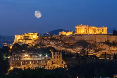 a view of the acropolis at night at Hidesign Athens Luxury Apartments in Kolonaki in Athens