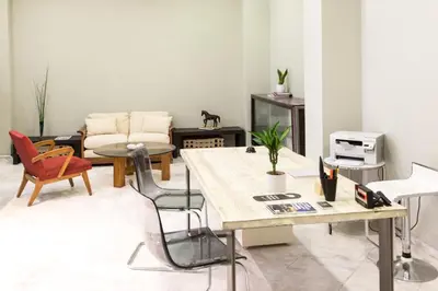 a living room with a table and chairs at Concierge Downtown in Athens