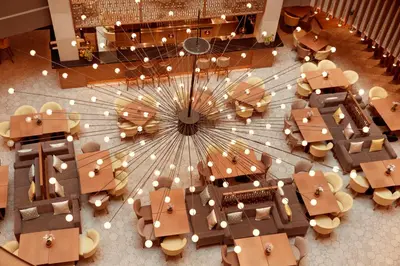 an overhead view of a restaurant with a circular ceiling at Zeus Wyndham Grand Athens in Athens