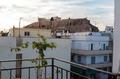 a view of a building with a hill in the background at Studio Acropolis in Athens