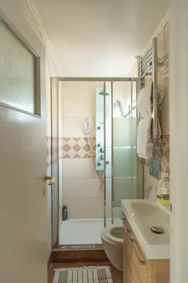 a bathroom with a shower and a toilet and a sink at Studio Acropolis in Athens
