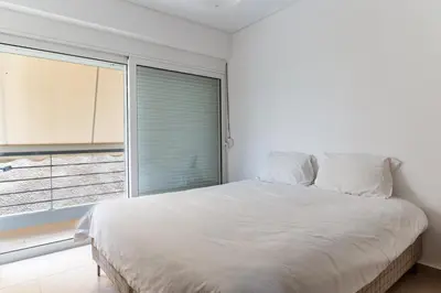 a bedroom with a large bed and a window at Elvita Spata Luxurious Villa in Spáta