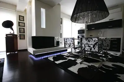 a living room with a fireplace and a television at Panorama Penthouse & Studios in Athens