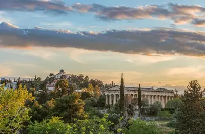 a view of a building with trees in the foreground at Suitas in Athens