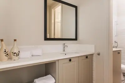 a bathroom with a sink and a mirror at 1930's Athenian House by YHA in Athens