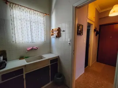 a bathroom with a sink and a window at Studio in Athens center in Athens