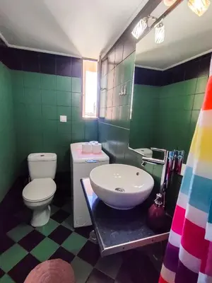 a colorful bathroom with a toilet and a sink at Studio in Athens center in Athens