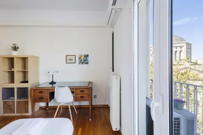 a small room with a desk and a window at 3 bdr Apt Incredible Acropolis View in Athens